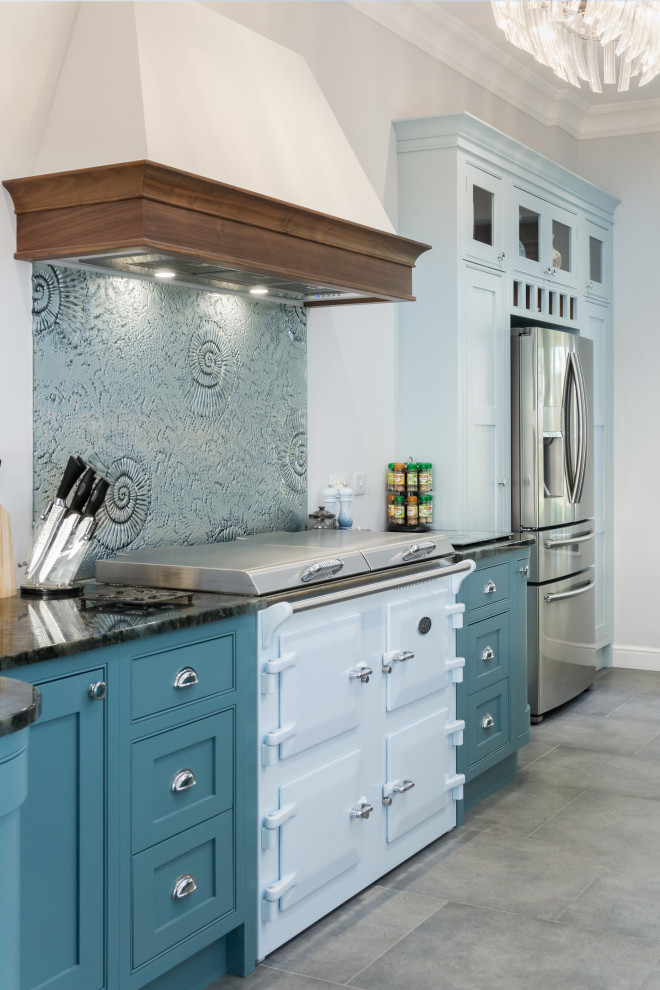 Large traditional kitchen in Other with a built-in sink, recessed-panel cabinets, blue cabinets, granite worktops, coloured appliances, ceramic flooring and black worktops.