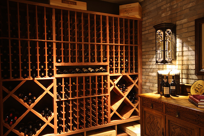 Inspiration for a rustic wine cellar remodel in Denver with storage racks