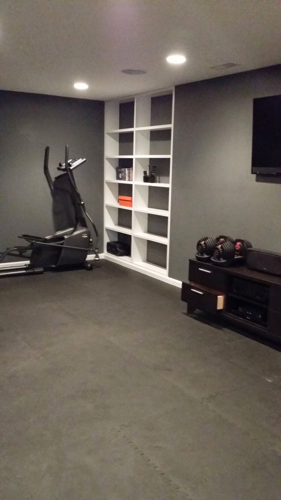 Mid-sized transitional home gym in Chicago with grey walls and cork floors.