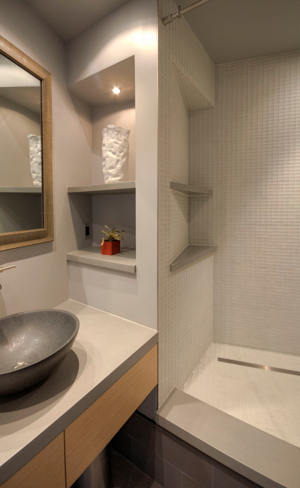 This is an example of a mid-sized asian master bathroom in San Francisco with flat-panel cabinets, light wood cabinets, an alcove shower, a one-piece toilet, white tile, grey walls, slate floors, a vessel sink and engineered quartz benchtops.