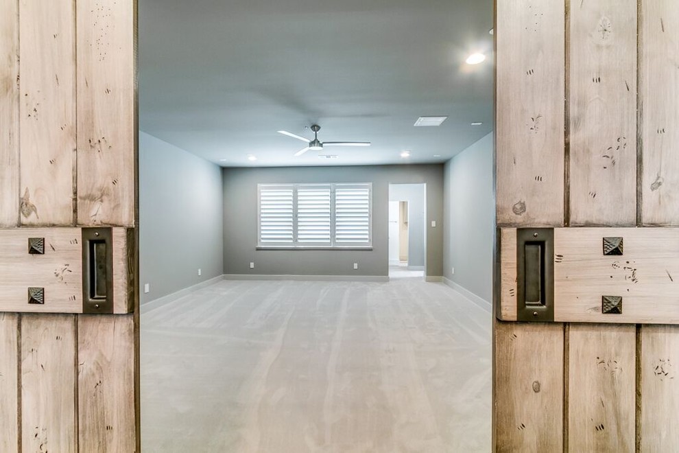 Inspiration for a transitional beige floor entryway remodel in Houston with white walls
