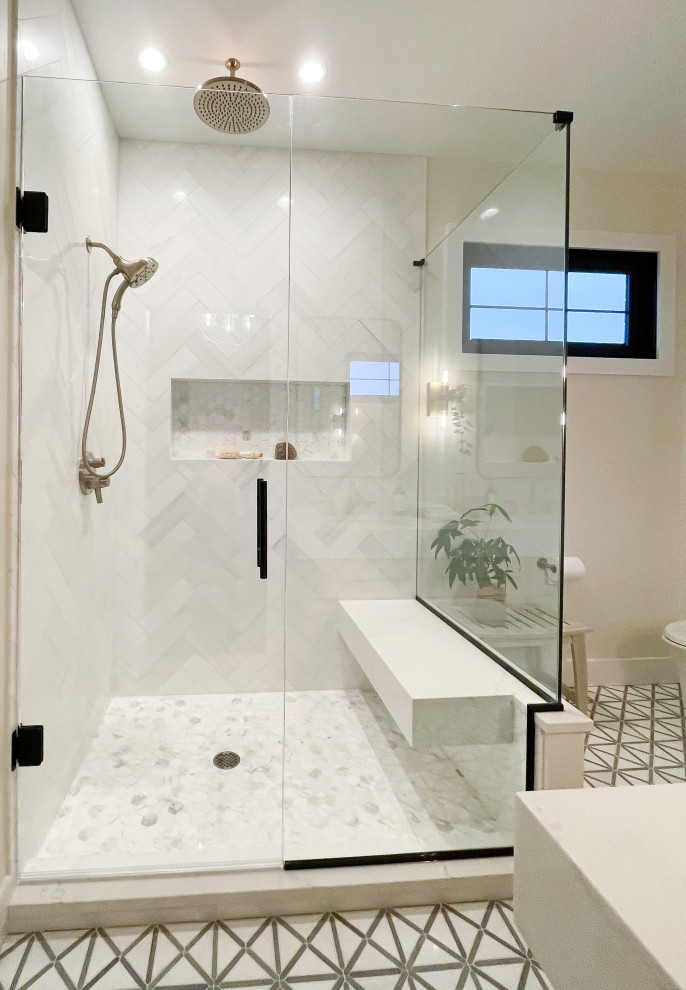 Bathroom - mid-sized contemporary master white tile and marble tile marble floor, gray floor and double-sink bathroom idea in Detroit with shaker cabinets, light wood cabinets, a wall-mount toilet, white walls, an undermount sink, quartz countertops, a hinged shower door, white countertops and a freestanding vanity