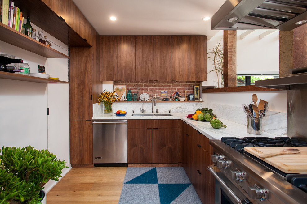 Design ideas for a mid-sized contemporary l-shaped separate kitchen in Los Angeles with a double-bowl sink, flat-panel cabinets, dark wood cabinets, white splashback, stone slab splashback, stainless steel appliances, marble benchtops, light hardwood floors, no island and yellow floor.
