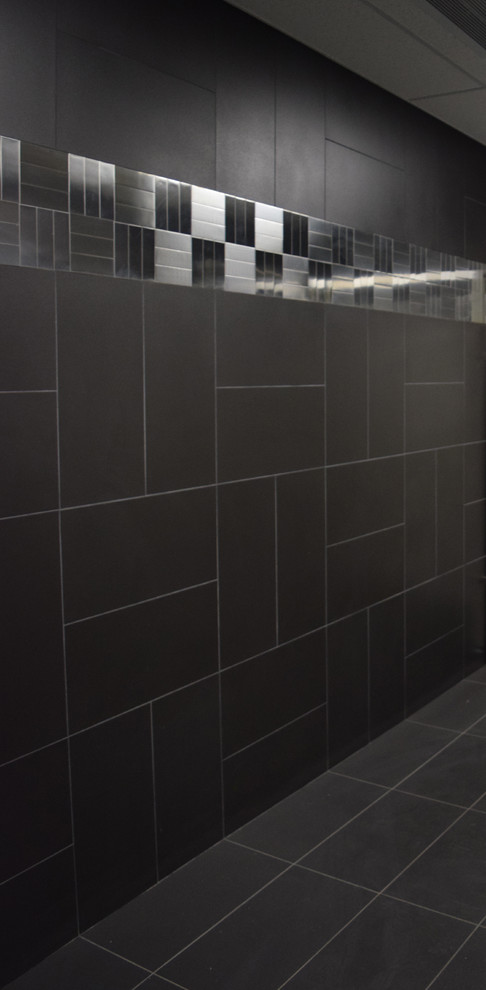 Inspiration for a contemporary bathroom in Columbus with black tile, metal tile and ceramic floors.