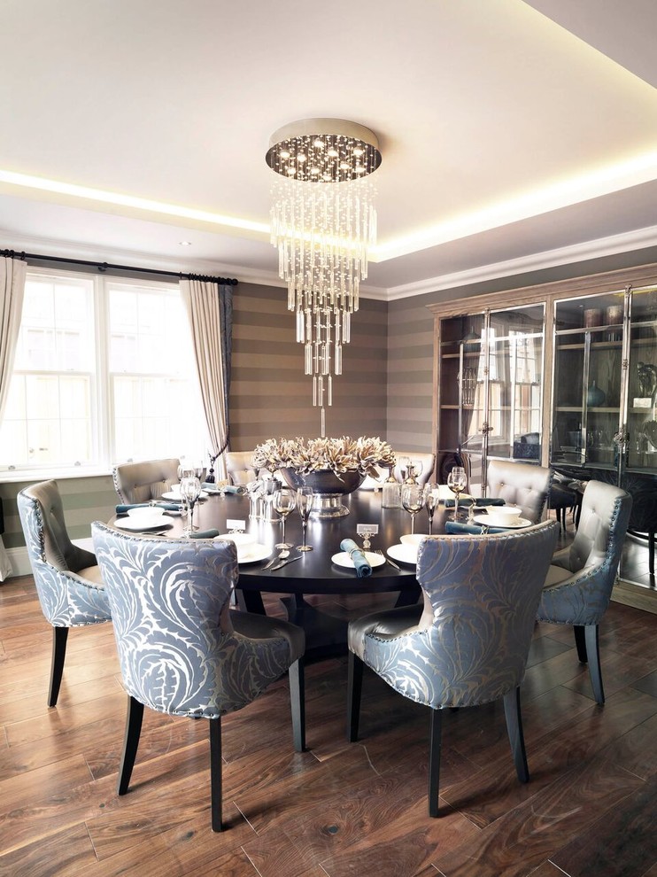 Inspiration for a mid-sized transitional dining room in Hampshire with multi-coloured walls and dark hardwood floors.