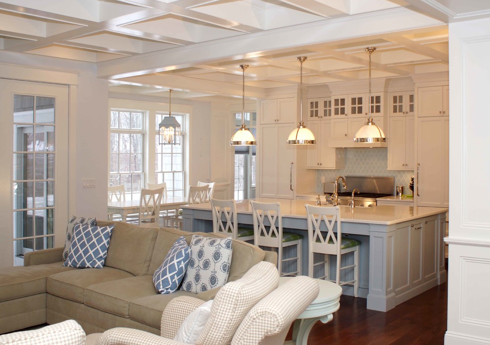 Inspiration for a large transitional dark wood floor eat-in kitchen remodel with an undermount sink, recessed-panel cabinets, white cabinets, quartzite countertops, blue backsplash, ceramic backsplash, stainless steel appliances and an island