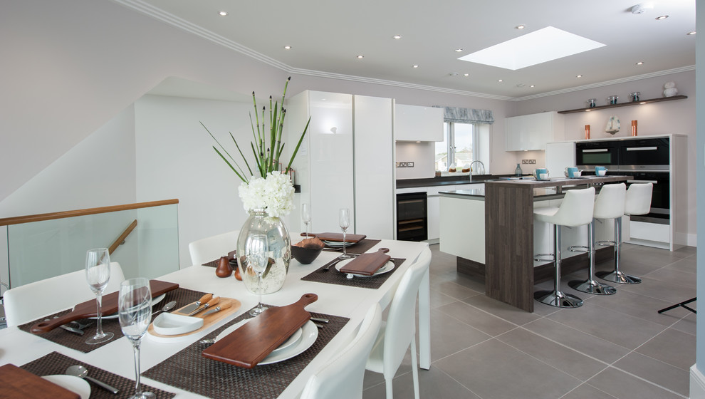 Design ideas for a contemporary kitchen in London with porcelain floors and grey floor.