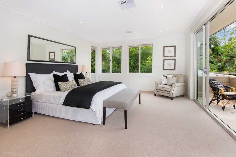 Photo of a transitional master bedroom in Sydney with white walls, carpet and no fireplace.