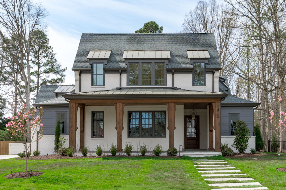 Example of a transitional exterior home design in Raleigh