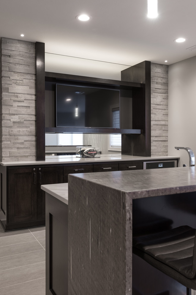 Mid-sized modern galley wet bar in Other with shaker cabinets, dark wood cabinets, granite benchtops and porcelain floors.