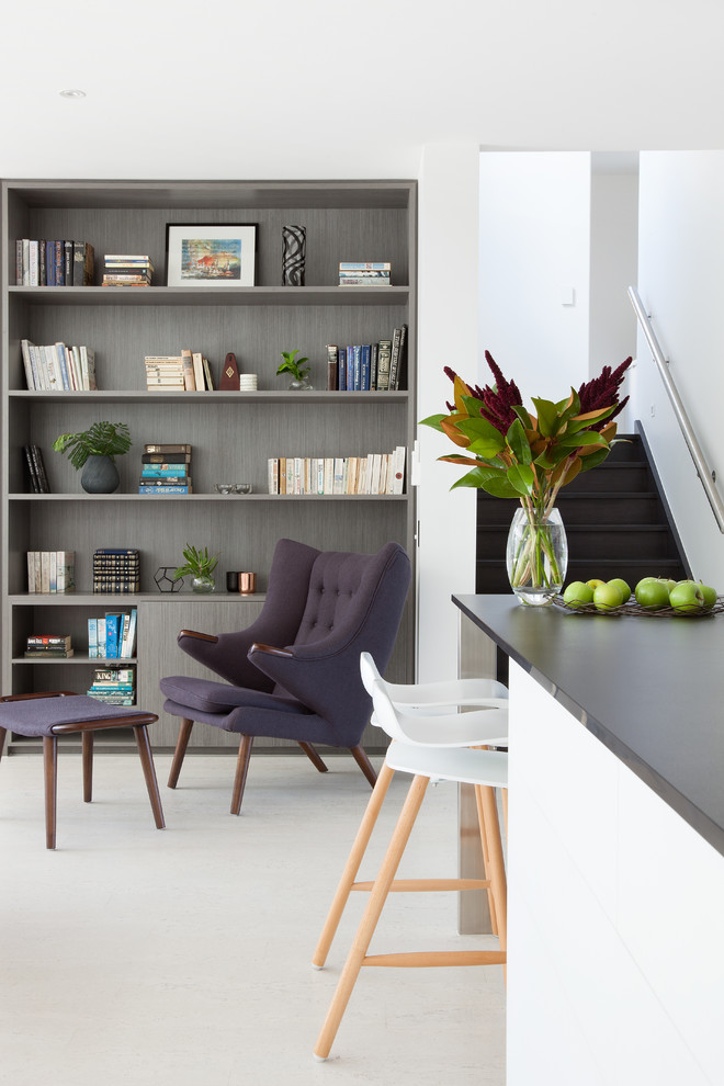 Mid-sized modern open concept living room in Melbourne with a library, white walls, cork floors and white floor.