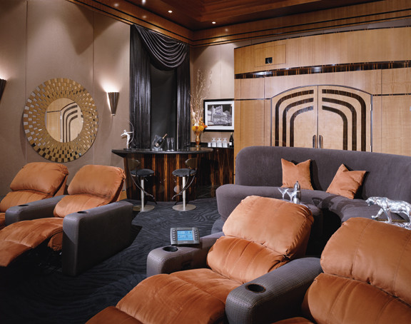 Large minimalist enclosed carpeted home theater photo in Los Angeles with beige walls and a projector screen