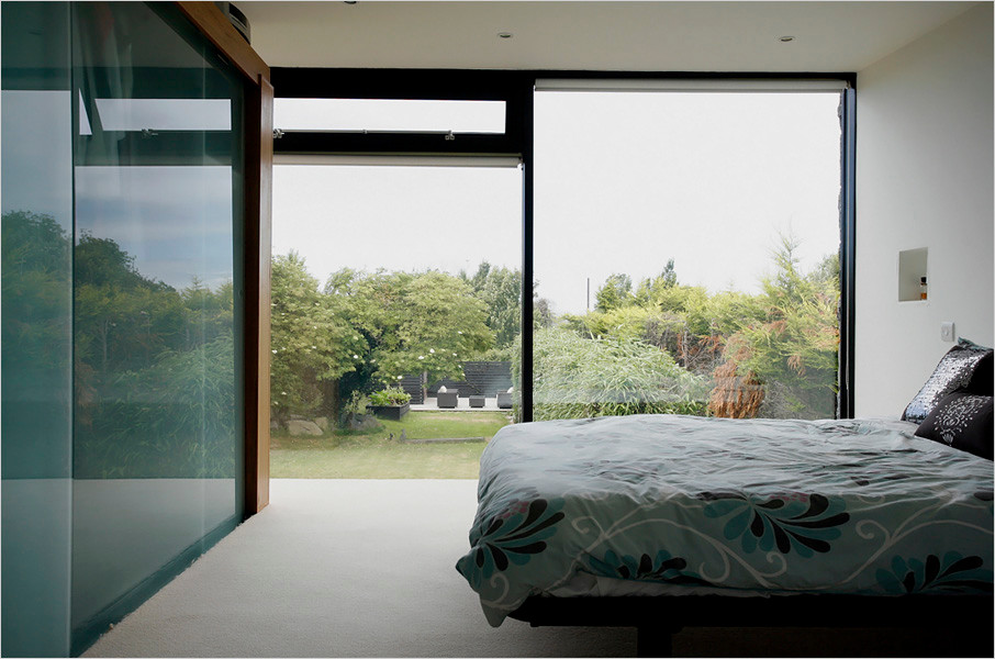 Contemporary bedroom in Channel Islands.