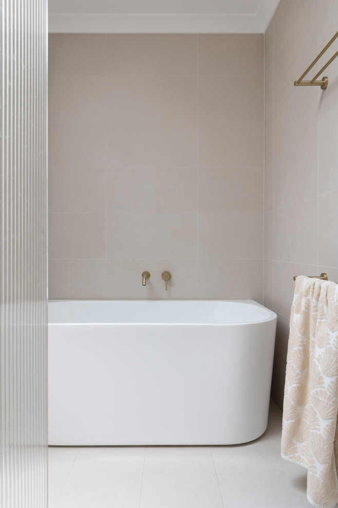 This is an example of a mid-sized beach style kids bathroom in Perth with flat-panel cabinets, light wood cabinets, a freestanding tub, an open shower, a two-piece toilet, gray tile, ceramic tile, white walls, ceramic floors, a vessel sink, marble benchtops, grey floor, white benchtops, a shower seat, a double vanity and a freestanding vanity.