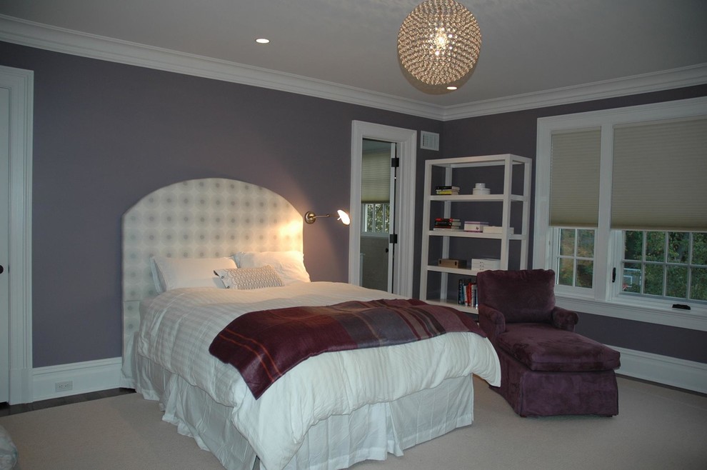 Photo of a transitional loft-style bedroom in New York with purple walls.