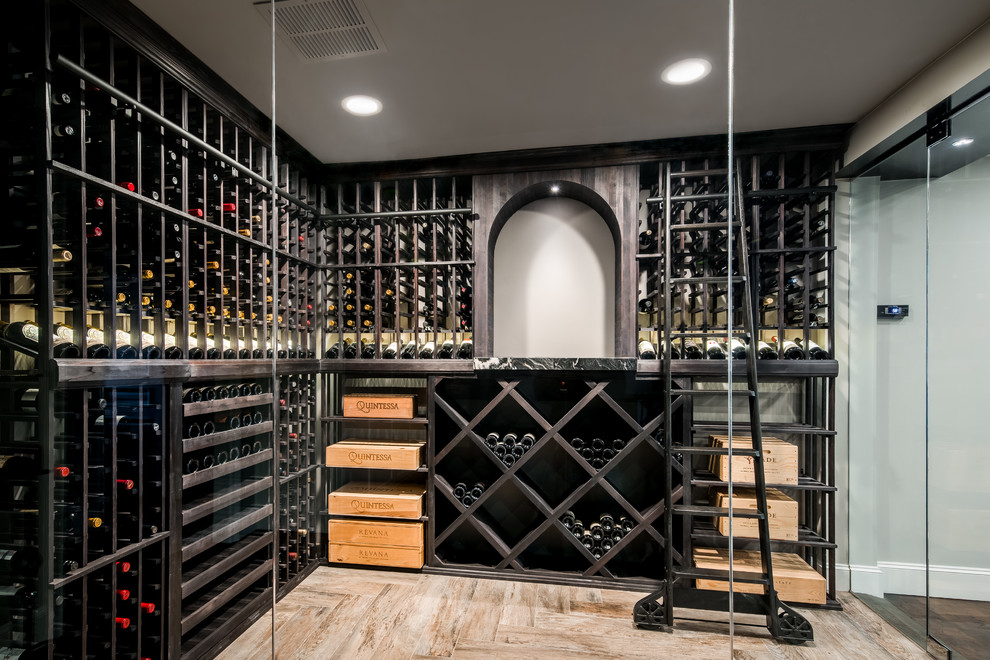 Large modern wine cellar in Dallas with medium hardwood floors, diamond bins and beige floor.