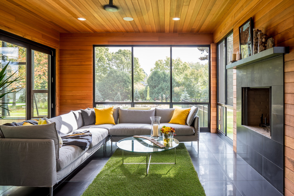 Inspiration for a huge contemporary open concept porcelain tile and gray floor living room remodel in Minneapolis with a standard fireplace, a tile fireplace, brown walls and no tv