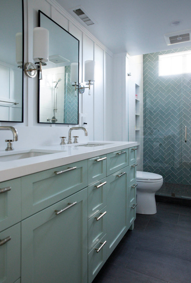 Inspiration for a mid-sized arts and crafts kids bathroom in San Francisco with shaker cabinets, turquoise cabinets, glass tile, white walls, porcelain floors, an undermount sink, engineered quartz benchtops, grey floor and white benchtops.
