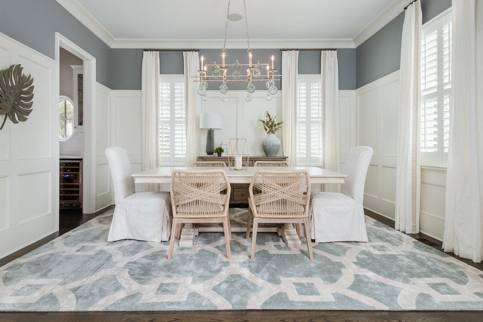Photo of a beach style separate dining room in Charlotte with blue walls, dark hardwood floors and brown floor.