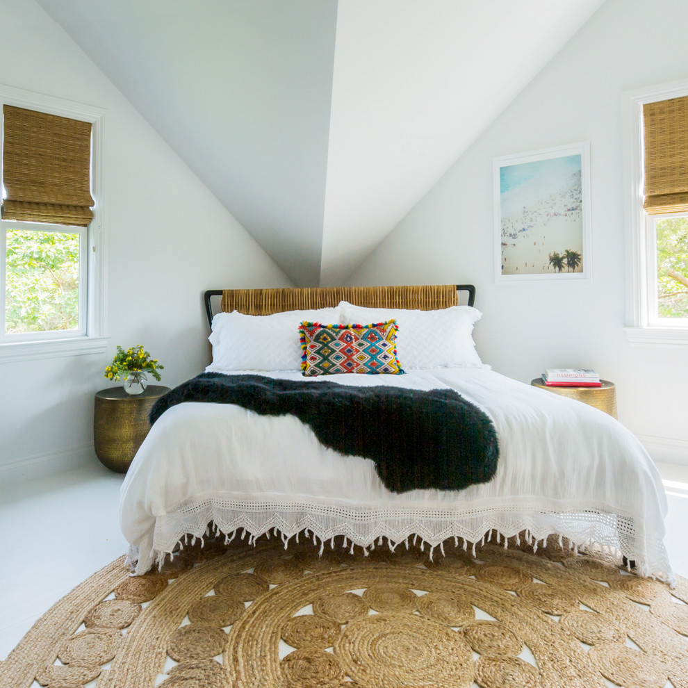 Inspiration for a beach style bedroom in New York with white walls and white floor.