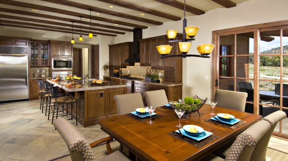 Open concept kitchen - rustic l-shaped terra-cotta tile open concept kitchen idea in Phoenix with an undermount sink, recessed-panel cabinets, medium tone wood cabinets, marble countertops, beige backsplash, ceramic backsplash, stainless steel appliances and an island