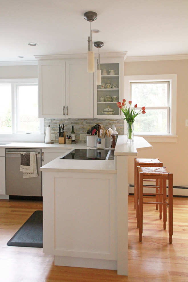 Eat-in kitchen - mid-sized transitional u-shaped eat-in kitchen idea with flat-panel cabinets, white cabinets and a peninsula