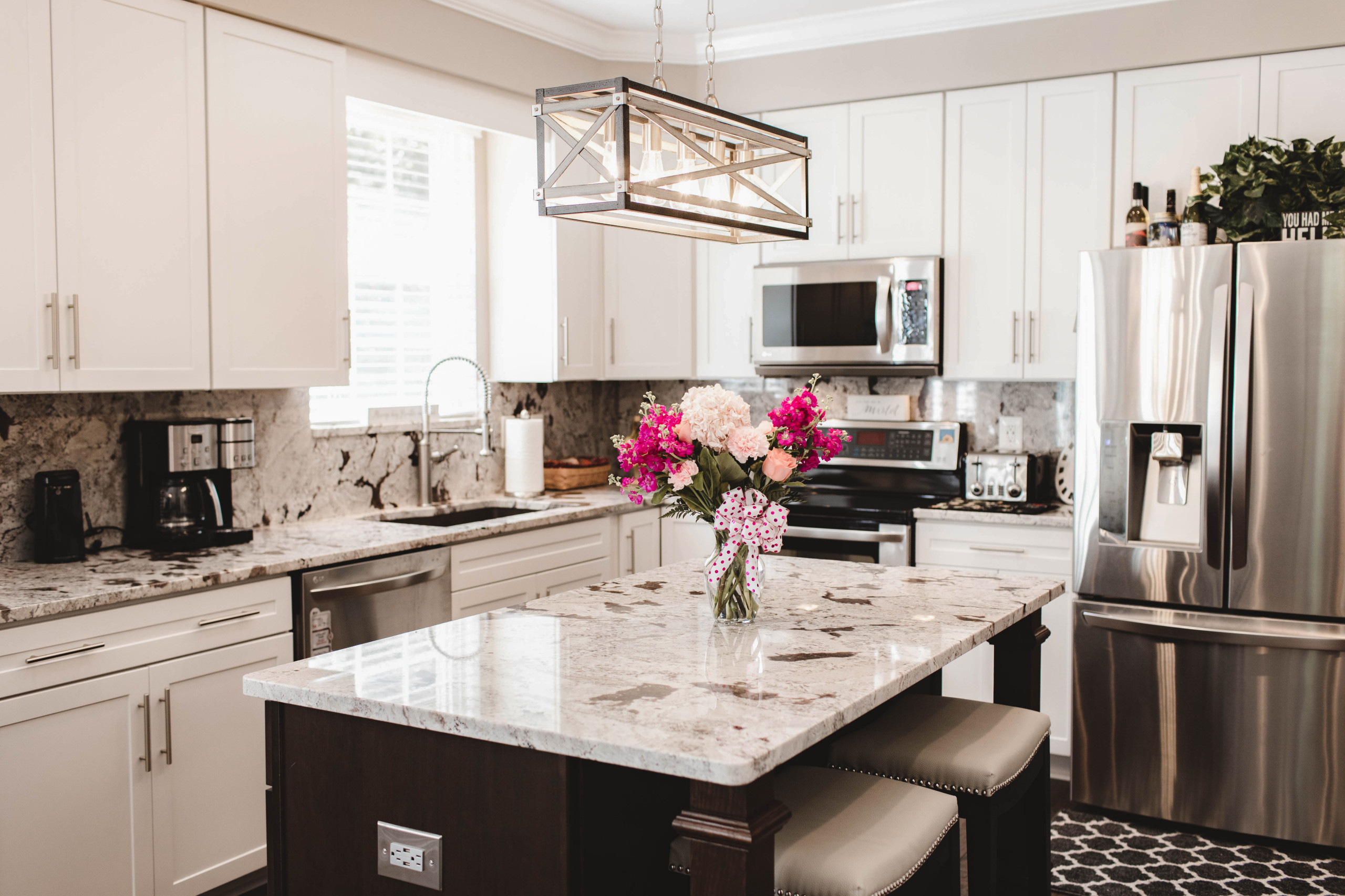 Open concept kitchen - mid-sized transitional l-shaped medium tone wood floor and brown floor open concept kitchen idea in DC Metro with an undermount sink, shaker cabinets, white cabinets, granite co