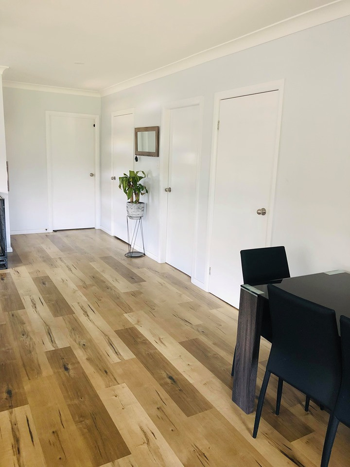 Inspiration for a contemporary dining room with white walls and bamboo floors.