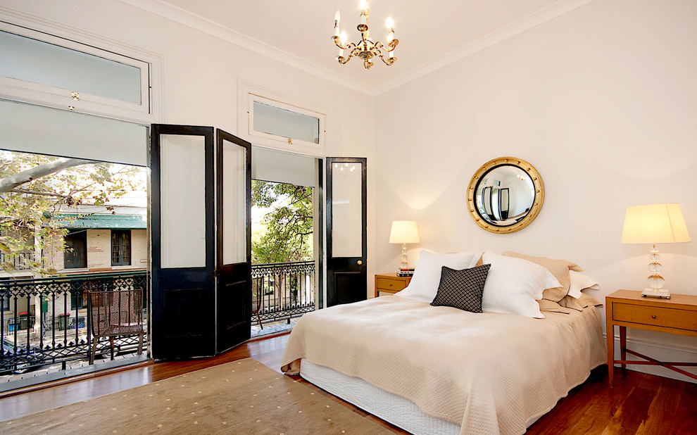 Inspiration for a transitional bedroom in Sydney with white walls and dark hardwood floors.