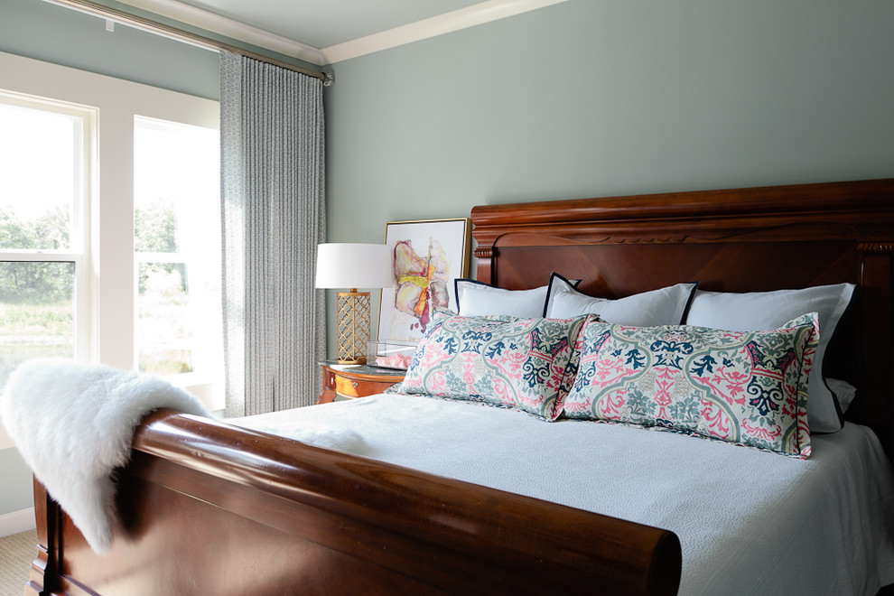 Example of a mid-sized beach style master carpeted bedroom design with blue walls