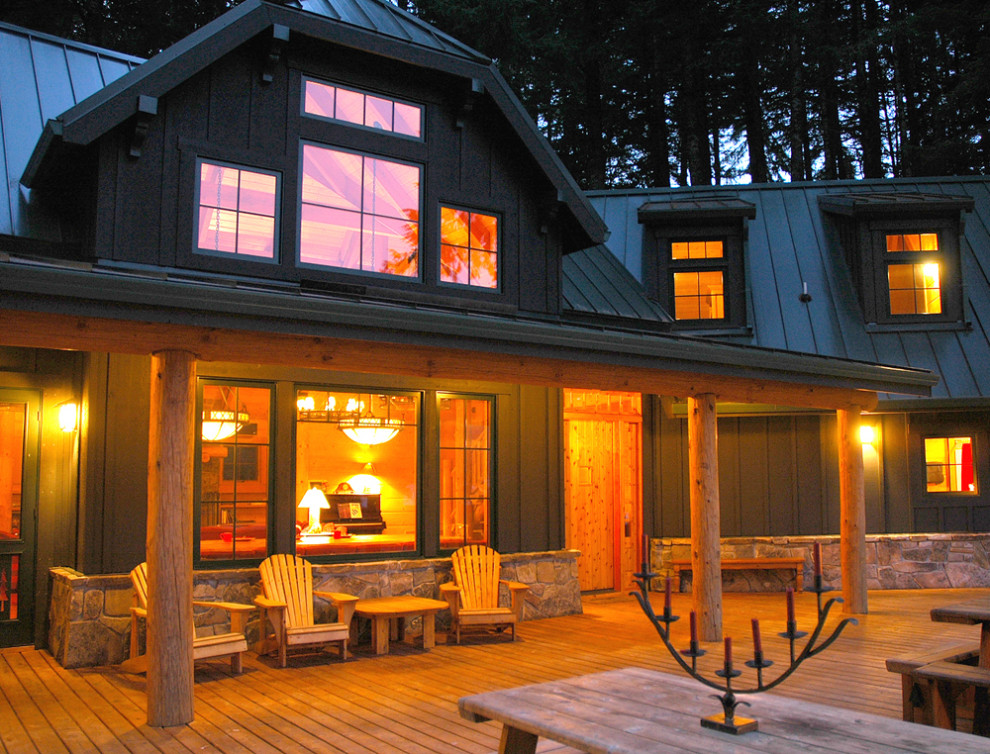 Huge mountain style deck photo with a roof extension