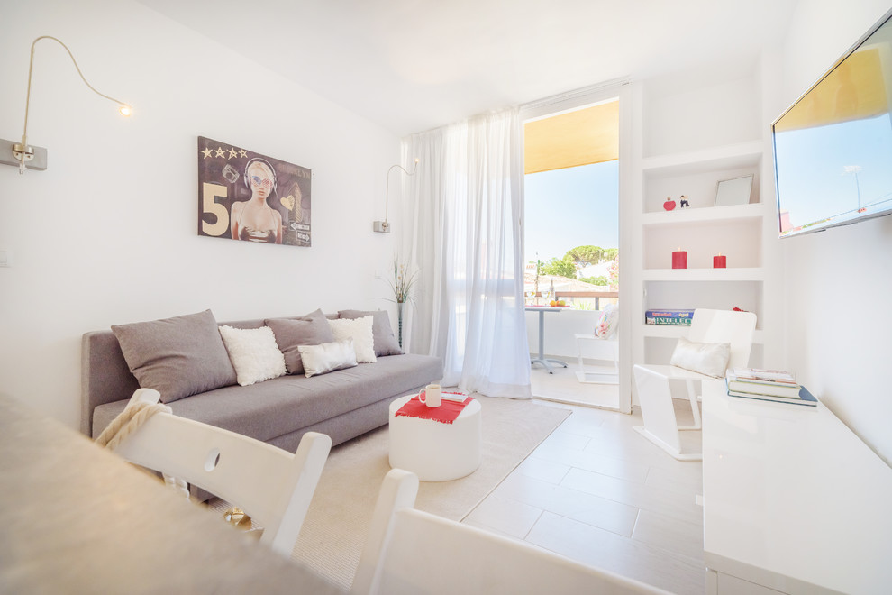 This is an example of a small modern bedroom in Malaga with white walls, porcelain floors and beige floor.