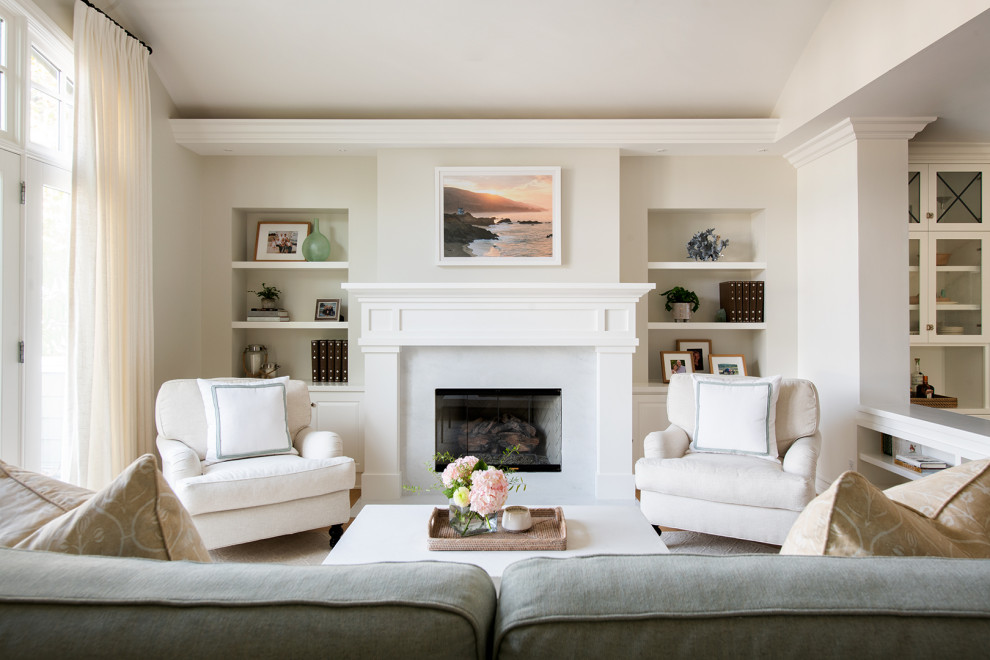 This is an example of a classic living room in Los Angeles with a standard fireplace.
