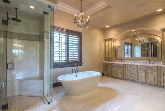 Huge transitional master white tile and porcelain tile porcelain tile drop-in bathtub photo in Phoenix with flat-panel cabinets, medium tone wood cabinets, a one-piece toilet, beige walls, a drop-in sink and granite countertops