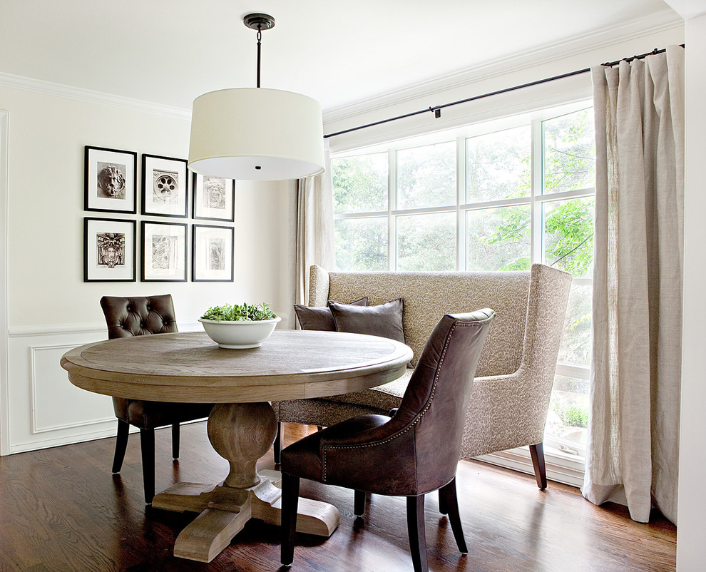Inspiration for a traditional dining room in Seattle with white walls and dark hardwood floors.