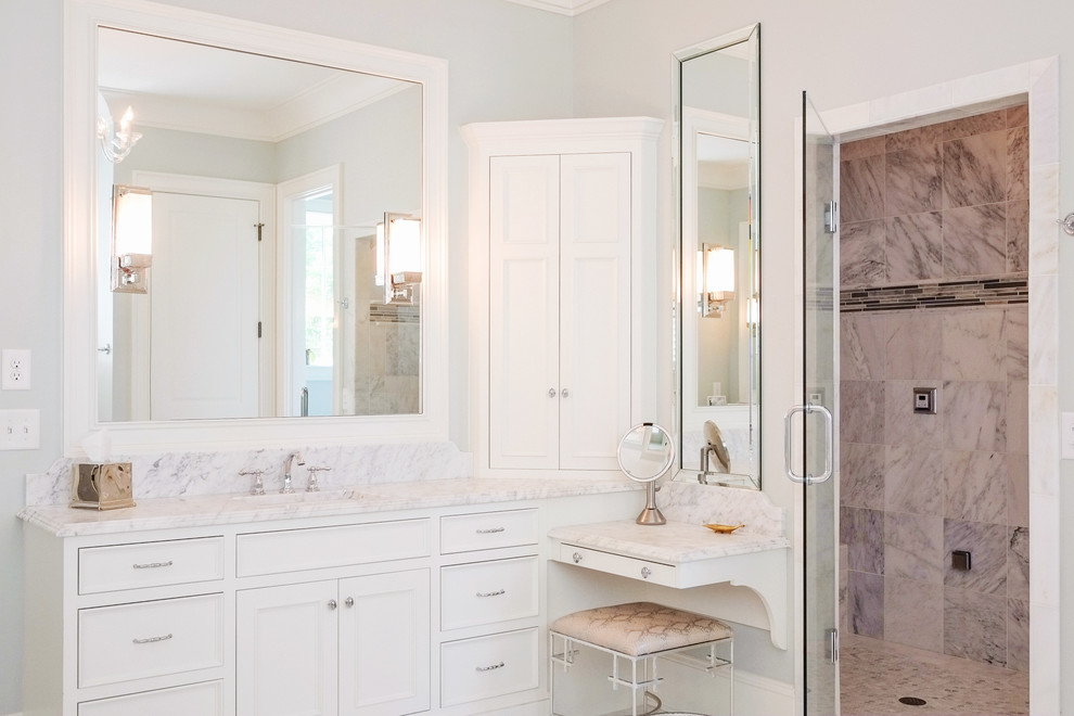 Inspiration for a large traditional master bathroom in Raleigh with recessed-panel cabinets, white cabinets, an alcove shower, grey walls, an undermount sink, marble benchtops and a hinged shower door.