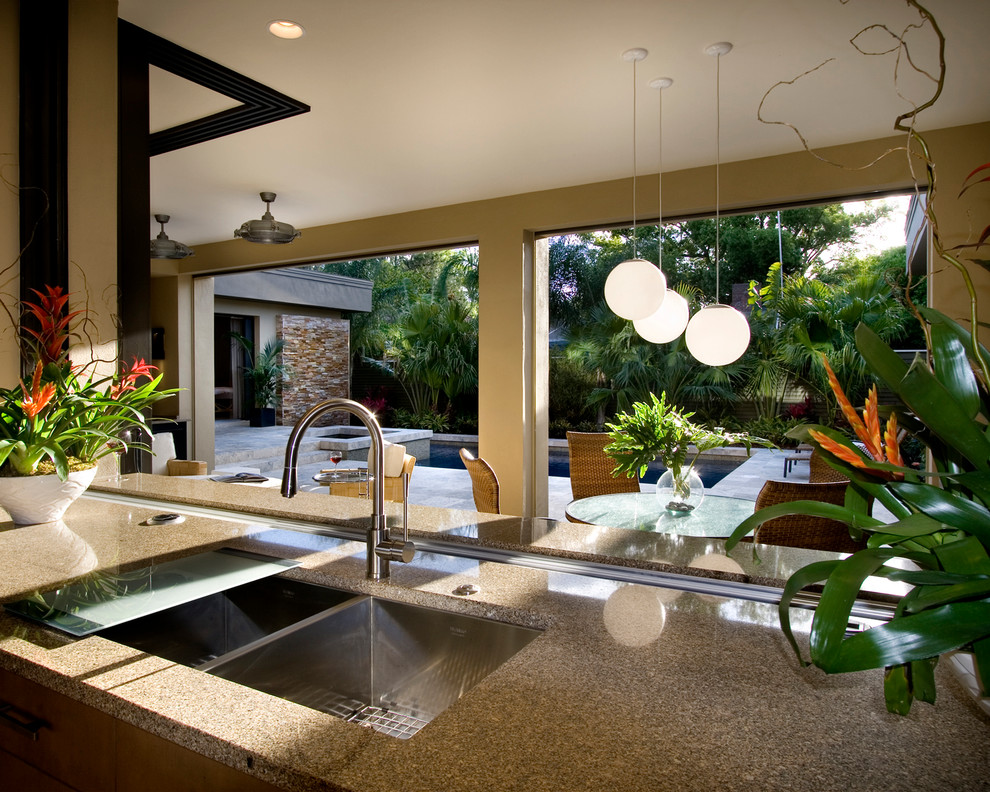 Photo of a large asian l-shaped eat-in kitchen in Houston with an undermount sink, granite benchtops, stainless steel appliances and with island.