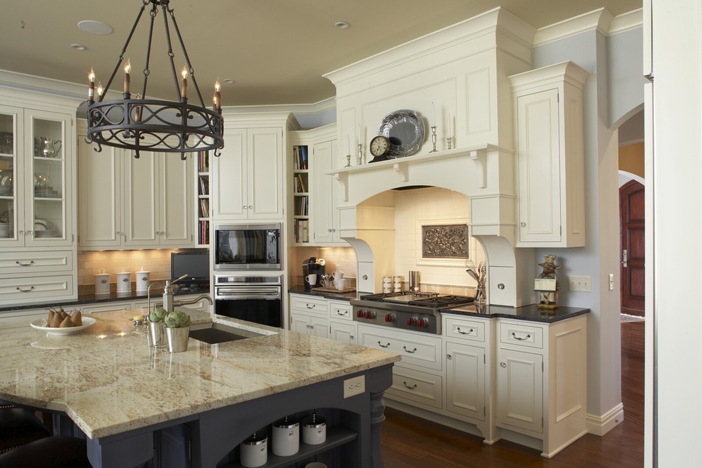 Traditional kitchen in Minneapolis with recessed-panel cabinets and beige cabinets.