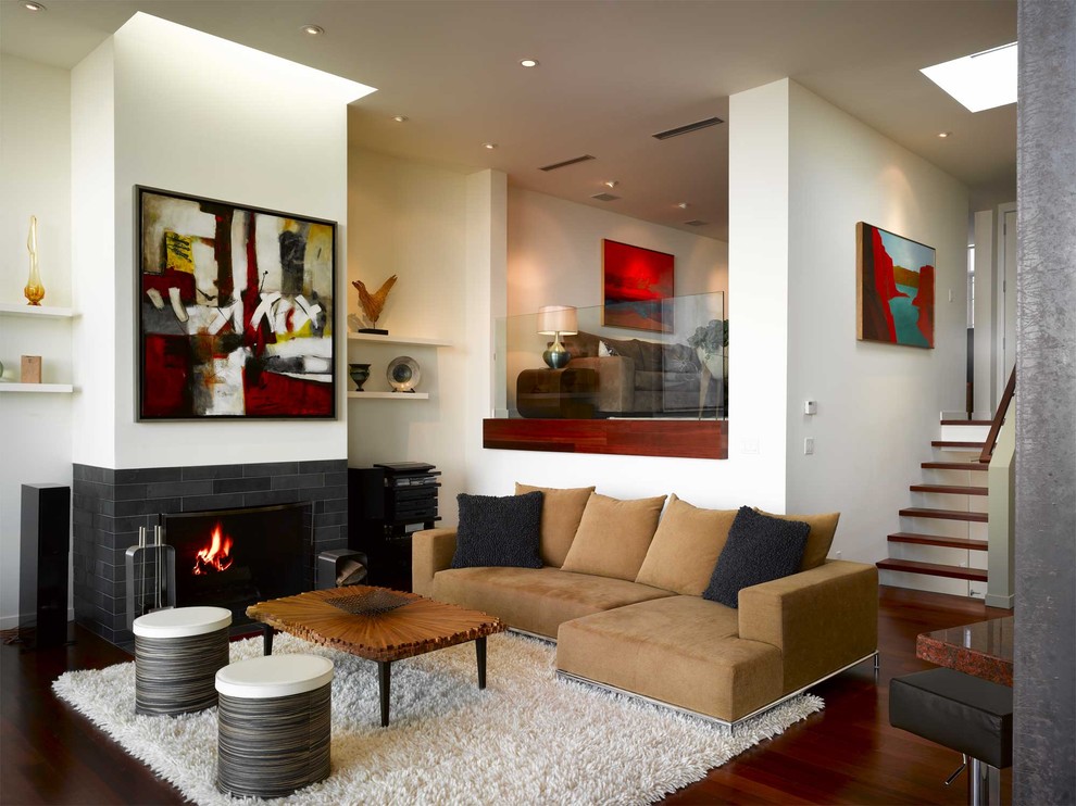 Photo of a mid-sized modern formal enclosed living room in San Francisco with a tile fireplace surround, white walls, dark hardwood floors, a standard fireplace and brown floor.