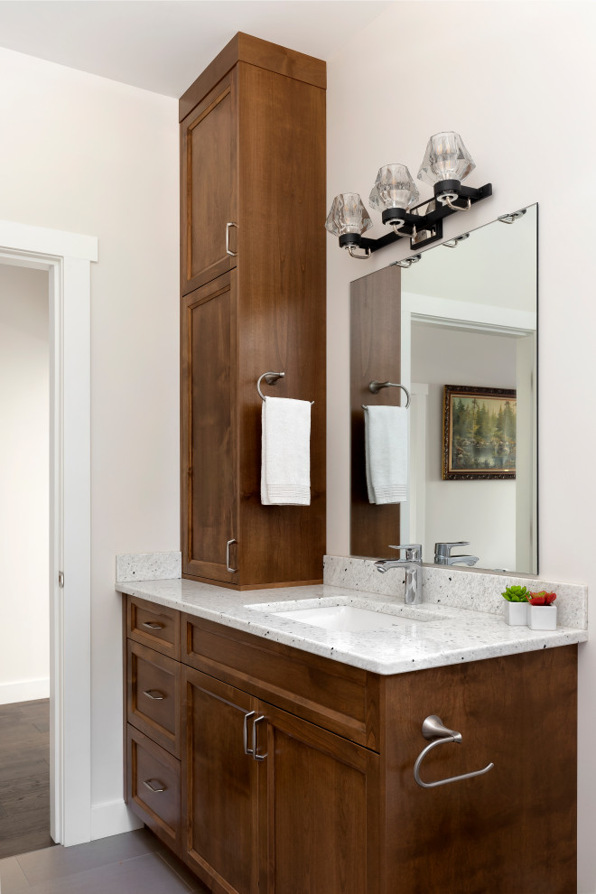 Mid-sized transitional 3/4 white tile and porcelain tile ceramic tile, gray floor and single-sink alcove bathtub photo with shaker cabinets, dark wood cabinets, a wall-mount toilet, white walls, an undermount sink, quartzite countertops, a hinged shower door, multicolored countertops and a built-in vanity