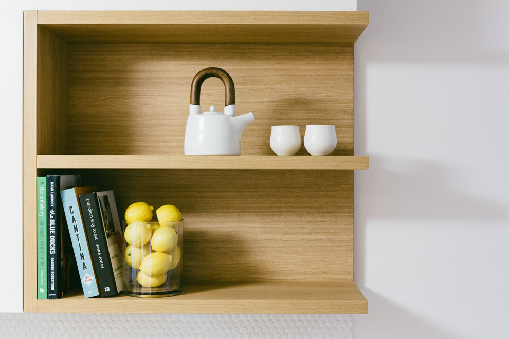 Inspiration for a mid-sized contemporary galley separate kitchen in Adelaide with an undermount sink, flat-panel cabinets, white cabinets, quartz benchtops, white splashback, mosaic tile splashback, stainless steel appliances, porcelain floors, no island and grey floor.