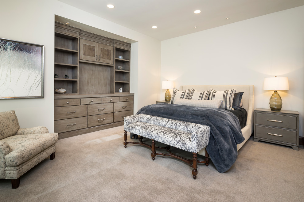 This is an example of a large country guest bedroom in Salt Lake City with white walls, carpet, no fireplace and grey floor.