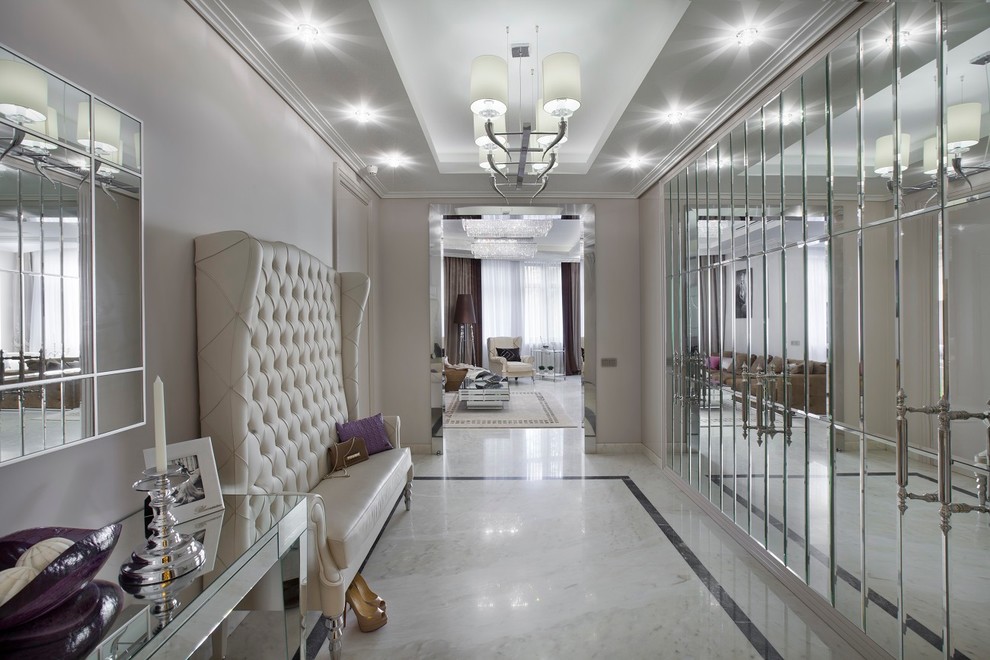 Photo of a transitional hallway in Moscow with beige walls and white floor.