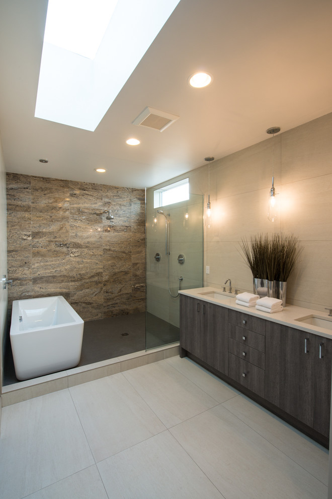 Photo of a mid-sized contemporary master bathroom in Seattle with an undermount sink, flat-panel cabinets, dark wood cabinets, a freestanding tub, an open shower, beige tile, stone tile, beige walls, porcelain floors, engineered quartz benchtops and an open shower.