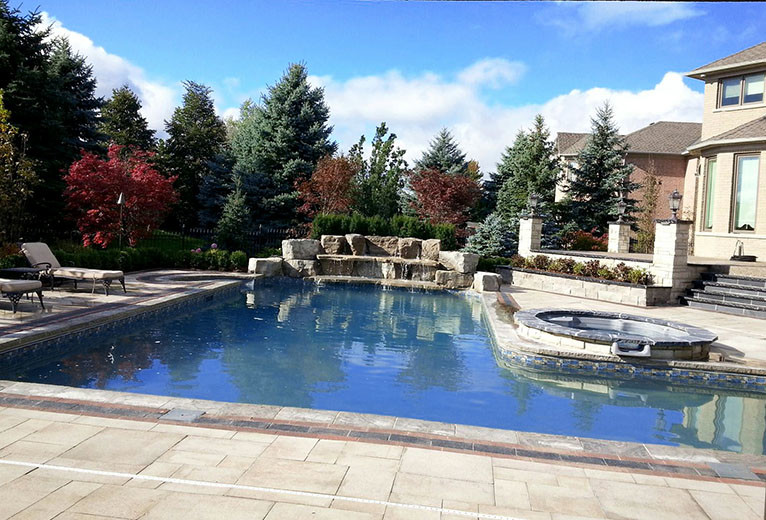 Inspiration for a large transitional backyard stone and l-shaped hot tub remodel in Toronto