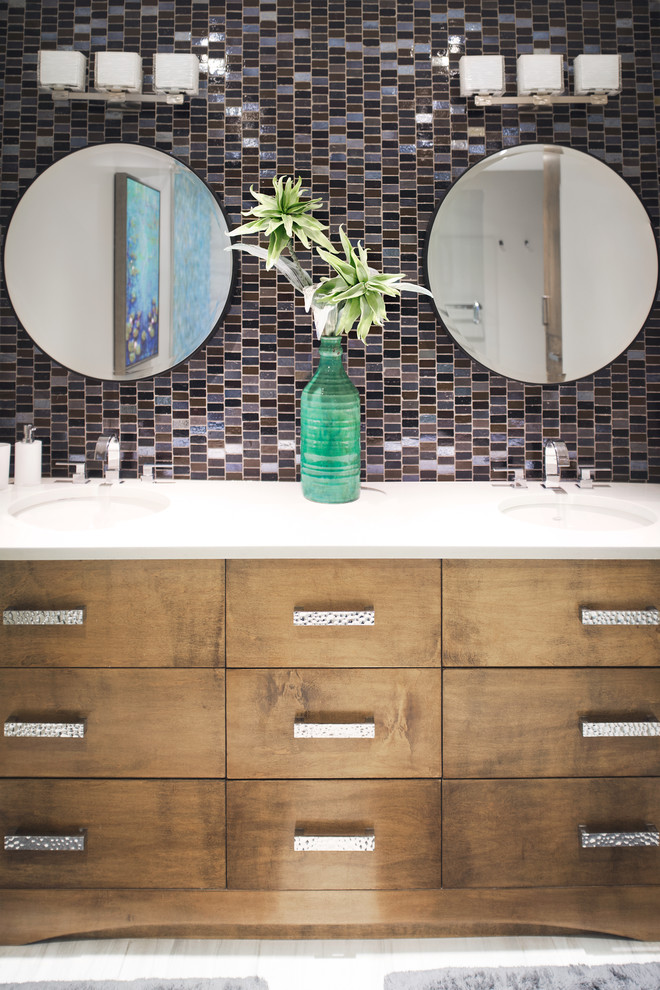 Inspiration for a mid-sized contemporary 3/4 bathroom in Ottawa with flat-panel cabinets, medium wood cabinets, black tile, blue tile, brown tile, gray tile, glass sheet wall, grey walls, porcelain floors, an undermount sink, engineered quartz benchtops and multi-coloured floor.