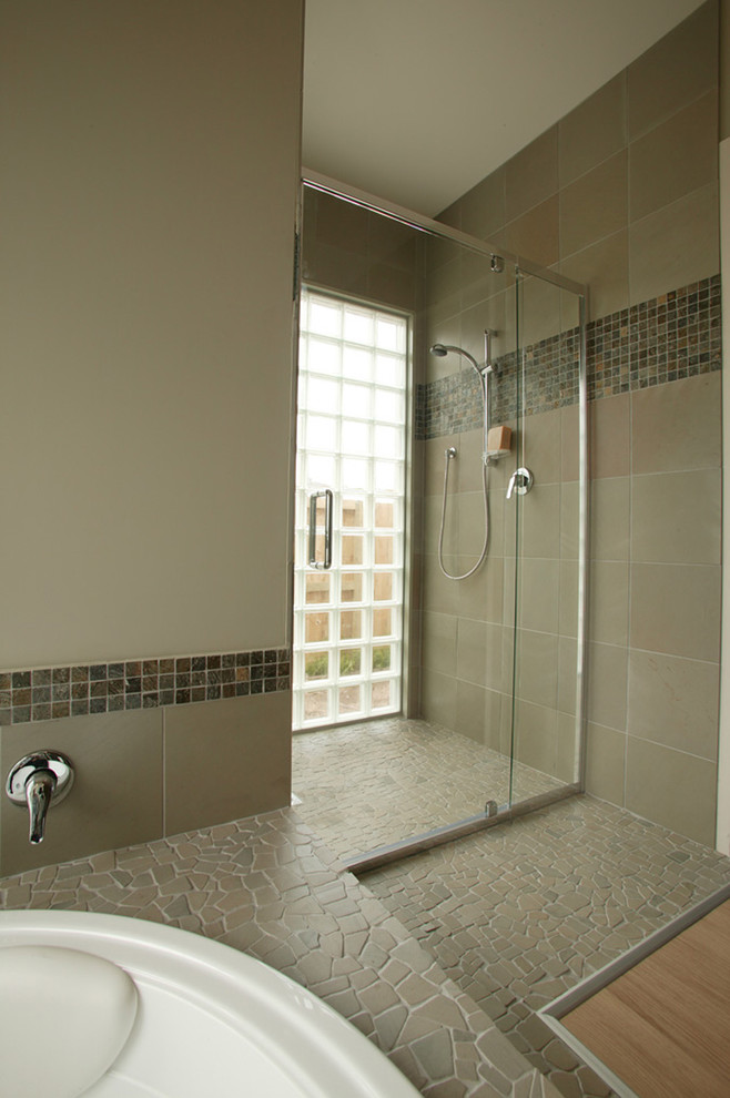 Design ideas for a modern bathroom in Other with mosaic tile.