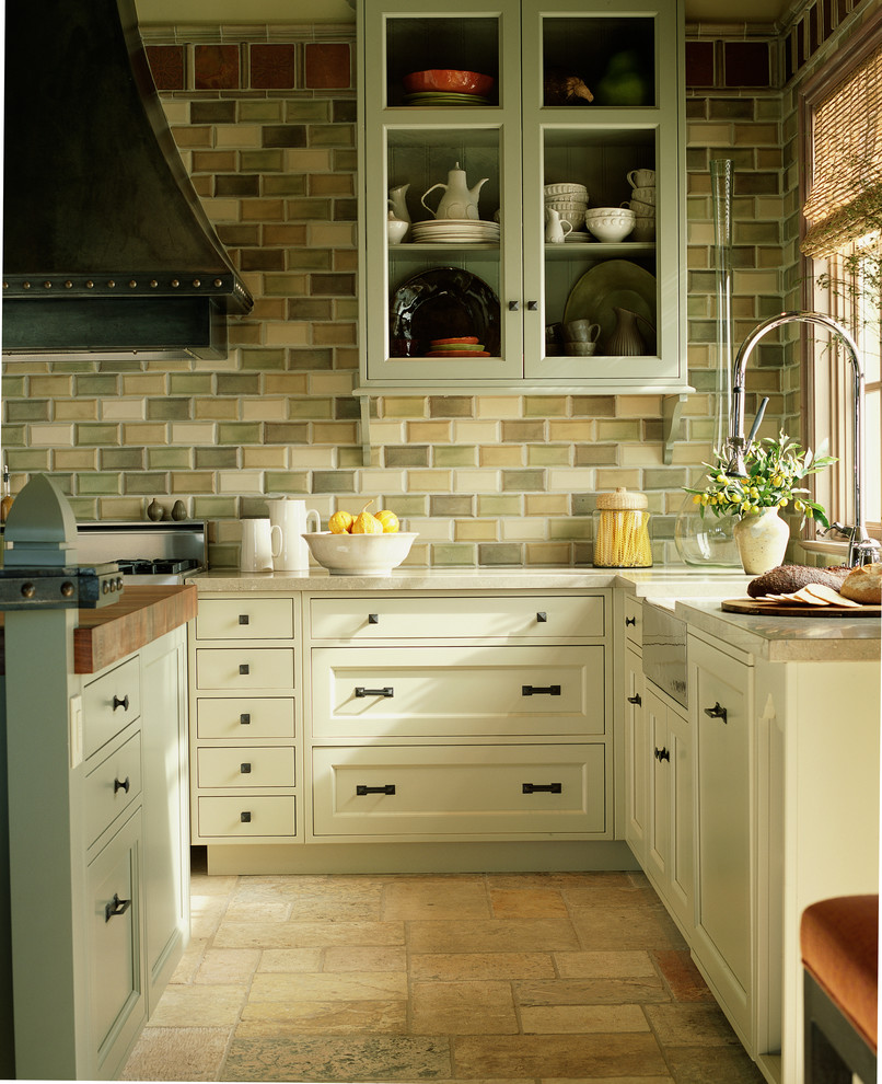 Inspiration for a mid-sized arts and crafts u-shaped kitchen in Denver with a farmhouse sink, shaker cabinets, beige cabinets, beige splashback, porcelain splashback, stainless steel appliances and with island.