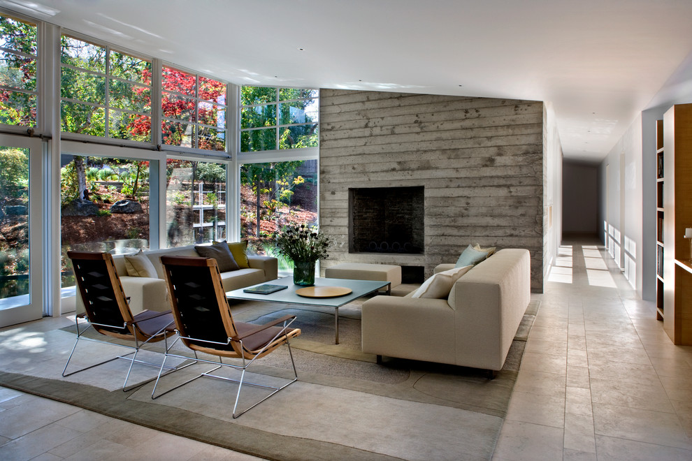 This is an example of a mid-sized contemporary open concept living room in San Francisco with a concrete fireplace surround.