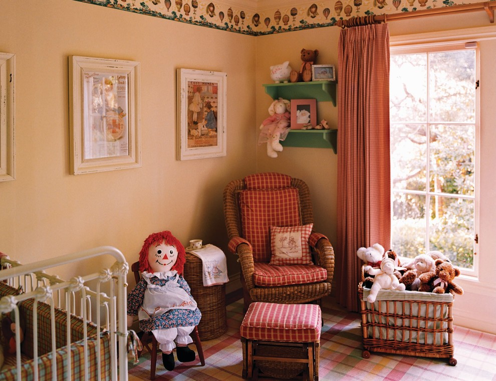 Photo of a traditional nursery for girls in San Francisco with beige walls.